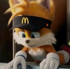 a close up of a stuffed animal with a mcdonalds hat on it's head