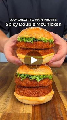 two sandwiches stacked on top of each other with the words low calorie & high protein spicy double mcchicken