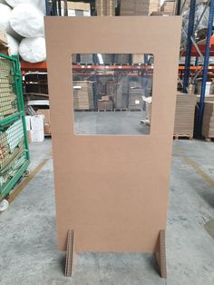 a cardboard box sitting on top of a pallet in a warehouse