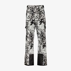 a pair of black and white pants with paint splattered on the side,