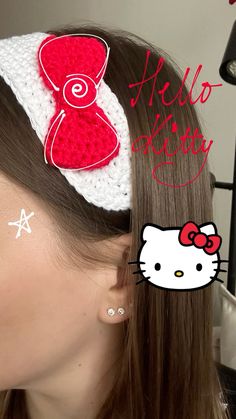 a woman with her hair in a crochet hello kitty headband and the words hello kitty written on it