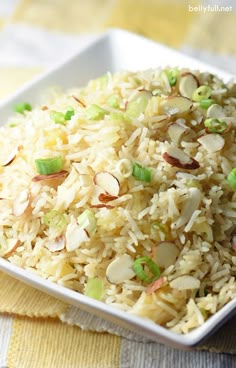 a white plate topped with rice and peas