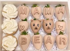 a box filled with chocolate covered strawberries and cupcakes