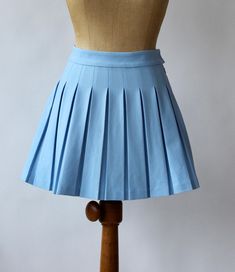 Vintage 1980s High Waisted Baby Blue Pleated Short Skirt    Materials: Syntenic Label: None Fit size  XS/S  Waist 33 cm - 13 inches Length 40,5 cm - 16 inches Zipper in the side Very good vintage condition Follow us on Instagram @by_waltz https://www.instagram.com/by_waltz/ Blue Short Skirt, High Waisted Mini Skirt, Light Blue Shorts, Waltz, Short Skirt, Blue Shorts, Baby Blue, Mini Skirt, Womens Skirt