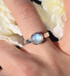 ⮚⮚ About The Design ⮘⮘ This lunar themed sterling memorial ring combines a sleek yet slightly chunky style with an 8mm Rainbow Moonstone centerpiece.  The hand-hammered 3.25mm comfort band is a nod to the moon's craters, complimented by the stone's gentle blue glow. Your beloved's ashes are held within our specially handcrafted urn setting. After the ashes are placed and your choice of stone is set, your memorial is lovingly gift-wrapped for its journey back to you.  ⮚⮚ Sending Ashes for Your Cr Hand Forged Moonstone Jewelry For Anniversary, Anniversary Hand Forged Moonstone Jewelry, Hand Forged Moonstone Ring In Sterling Silver, Celestial Sterling Silver Moonstone Ring For Anniversary, Celestial Moonstone Ring In Sterling Silver For Anniversary, Unique Sterling Silver Moonstone Ring With Bezel Setting, Unique Moonstone Ring In Sterling Silver With Bezel Setting, Spiritual Untreated Moonstone Ring For Anniversary, Untreated Sterling Silver Moonstone Ring For Gift