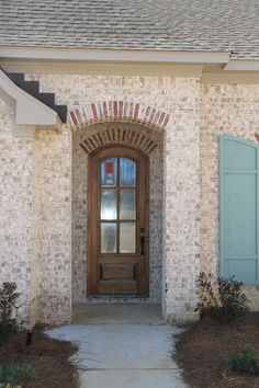 Ansley Park Brick House Detail Photos. The house has Teal shutters and copper accents Brick Accent Exterior, Brick Accent Exterior House, Exterior Curb Appeal, Ranch House Remodel, Brick Homes, Commercial Construction, House Features, Brick House, House Remodel