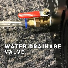 a water drainage valve with the words water drainage valve on it's side next to a wrench