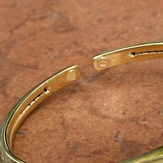 14K yellow gold knife-edge, slip-on, cuff bangle bracelet. One side is a matte-finish and the other side is polished! Reversible! Two ways to wear it! Measures 6 + 5/8" Around Width: 6.5mm Slip on; no clasp Hollow bangle One side matte/satin finish, One side shiny Weight: 5.60 grams Finished on all sides Stamped 14K Solid gold Flexible cuff when taking off/on Elegant Gold Magnetic Bracelets, Elegant Gold Magnetic Bracelet, Gold Knife, Cuff Bangle Bracelet, Matte Satin, Cuff Bangles, The Other Side, Bangle Bracelet, Satin Finish