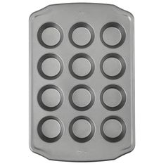 a metal muffin pan with nine cupcakes in it on a white background