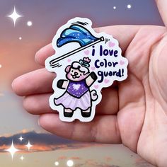 a sticker of sprout the sheep in a purple dress tossing a blue flag mid-air with the text I love color guard A Flag, Color Guard, Marching Band, Make Color, Vibrant Design, Sprouts, Design Features, Water Bottle, Notebook