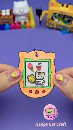 a person holding up a small card with an image of a cat and dog on it