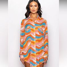 Sheer, Textured Fabric Point Collar Button Cuff Long Sleeves Rhinestone Embellished Button Up Closure Groovy Swirl Print Ddual Front Pockets Oversized Silhouette 100% Polyester Chic Multicolor Shirt With Button Closure, Chic Orange Blouse For Vacation, Chic Multicolor Blouse With Buttons, Chic Orange Collared Blouse, Retro Long Sleeve Beach Shirt, Orange Buttoned Top For Vacation, Chic Orange Long Sleeve Blouse, Retro Long Sleeve Shirt For Beach, Multicolor Button Closure Blouse For Day Out