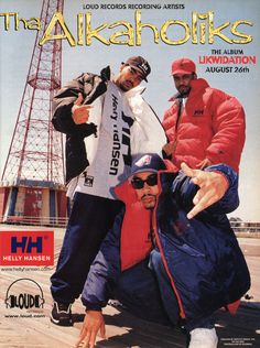 three men posing for the camera in front of a radio tower