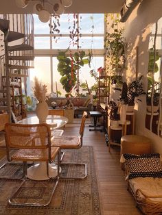 a room filled with lots of furniture and plants