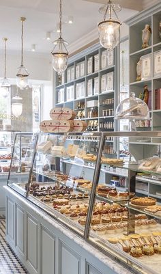 a bakery filled with lots of different types of pastries and desserts on display