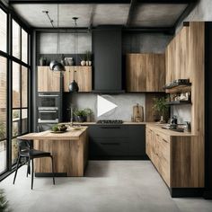 a modern kitchen with wooden cabinets and black counter tops, along with an open floor plan