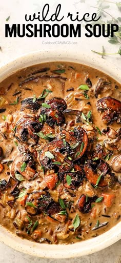 a white bowl filled with mushroom soup on top of a table