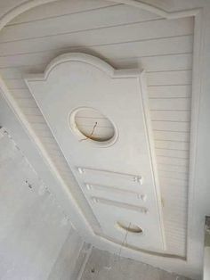 the ceiling is white and has a round hole in it