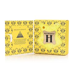 a yellow box with the letter h on it's front and back side, next to an empty package