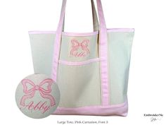 a pink and white tote bag next to a ball