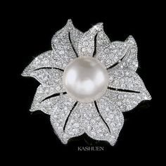 "PERFECT GIFT /WEDDING GIFT FOR BRIDE / BRIDESMAID / LADY! This is a Brand New, stunning Creme white Pearl Flower Brooch. The brooch is made with Swarovski crystals measuring 1 5/8\" (4.2cm) wide and 1 5/8\" (4.2cm) high. Crystal Color: Crystal Clear Prices are in US$. For shipping policies and other important information, click on \"profile\" on the right. See an item that you like but has already been sold? Contact me to see if I have more! Thank you for stopping by Kashuen Collectibles!" Flower Shaped Wedding Brooch, Flower-shaped Wedding Brooch, Silver Flower Brooch For Wedding, Silver Wedding Brooch With Flower Decoration, Silver Wedding Brooches With Flower Decoration, Silver Flower Wedding Brooches, Elegant Flower Bridal Accessories For Wedding, Elegant White Wedding Brooches, Elegant Floral Bridal Accessories For Wedding