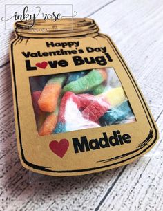 a jar filled with candy sitting on top of a table