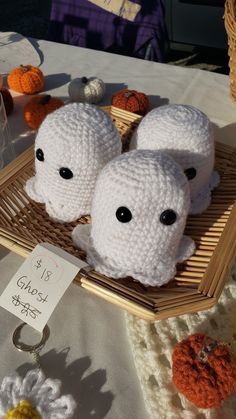 two crocheted stuffed animals sitting on top of a table