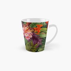 a tall mug with tropical flowers and leaves on it