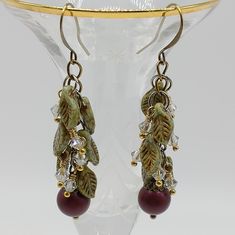 A Vibrant Swarovski Crystal Pearl In An Elderberry Shade Dangles Below A Cascade Of Czech Glass Leaves And Swarovski Crystal. Earrings Are Created In A Mixed Metal Style Using Silver, Gold And Antique Bronze. Length: 2-1/2" Handcrafted Falling Leaf, Earring Ideas, Swarovski Crystal Earrings, Czech Beads, Crystal Pearls, Metal Style, Glass Earrings, Bead Designs, Pretty Jewellery