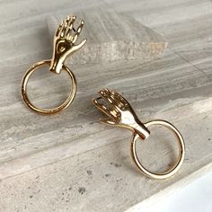 New~ Anthropologie Hand & Hoop Gold Earrings Featuring A Singe Golden Ring, In A Door Knocker Style, These Fun Hand & Hoop Earrings Are Sure To Make A Statement. Light Weight And Great For Everyday Wear. Shiny, 18k Gold-Plated Brass, Post Backs Included. Nwot. Approx. Size: 1.5"L, 3/4"W Anthro Style, Boho Style, Trendy, Brand New Anthropologie Jewelry, Ettika, Revolve, Shopbop, Shashi Jewelry, Everyday Hoop Earrings, Gold Hoops, Huge Hoops, Modern, Trendy, Post Back, Retro, 80's Style, Modern, C Hoop Gold Earrings, Anthro Style, Navy Earrings, Oversized Hoop Earrings, Earrings Gold Hoops, Jewelry Everyday, Anthropologie Earrings, Glass Drop Earrings, Jeweled Earrings