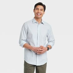 From work meetings to evening outings, stay cool, comfy and stylish in this Performance Dress Long-Sleeve Button-Down Shirt from Goodfellow & Co™. Tailored in a standard fit, this button-down shirt is crafted from a soft fabric blend with a hint of spandex for stretchy comfort. Designed with a collared neckline for classic style, you can wear it tucked in with dress pants or chinos with loafers or dress shoes for a special event, or sport it untucked with jean shorts or chambray pants for a more Casual Dress Shirt With Relaxed Fit For Office, Casual Dress Shirt With Spread Collar For Office, Casual Button-up Dress Shirt For Office, Casual Dress Shirt For Office In Fall, Casual Fall Dress Shirt For Office, Relaxed Fit Long Sleeve Dress Shirt For Business Casual, Black Dress Shirt Men, Chambray Pants, Blue Plaid Dress