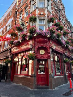 an old building with flowers growing on it