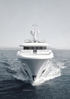 a large white boat in the middle of the ocean