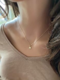 "This solid 14k gold charm is stunning and has a great detail. The slightly curved sun beams and its dome shape add dimension. The pendant measures approximately 8 mm. Now available with the 16 or 18\" dainty solid 14k gold chain. The sun will be suspended on 4 mm open bail (see 1st photo) If you only purchasing the charm, select bail size: 4 mm 14k open jump ring bail and can accommodate chains up to 1.6 mm. 6 mm 14k closed bail that can suit thicker necklaces. Hallmarked 14K 14k sand dollar ch Everyday Yellow Gold Sun Design Jewelry, Everyday Yellow Gold Jewelry With Sun Design, 14k Gold Sun Design Jewelry Gift, Dainty Sun Design Jewelry For Gifts, Elegant Sunburst Jewelry With Sun And Moon Design, Elegant Sunburst Jewelry Gift, Elegant Sun And Moon Design Sunburst Jewelry, Sun Design Charm Necklace Gift, Starburst Jewelry With Sun Design As A Gift