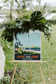 a sign that is on top of a wooden easel with plants growing out of it