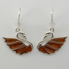 This is a beautiful and genuine pair of Amber Earrings in 925 Sterling Silver.  The amber is right from the capital of amber and silver: Gdańsk / Danzig, Poland The earrings are made out of solid 925 Silver and there is no nickel or other substances causing most allergies in the silver. This makes the earrings hypo allergenic. Size of one Earring in total 3.6 x 2.5 cm 1.42 x 0.98 inch Usually we ship on the same day we receive the payment for the order. We want you to be happy with your purchase Drilling Glass, Swan Earrings, Amber Earrings, Happy Customer, Amber Jewelry, Swans, Fine Jewellery Earrings, Baltic Amber, To Be Happy