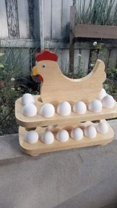 an egg carton filled with white eggs sitting on top of a cement block