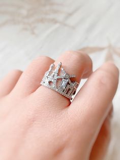 Celebrate the famous city of love with this iconic Paris cityscape ring! This beautiful travel ring depicts the Paris skyline - everything from the Eiffel tower to the famous Moulin Rouge. It is truly a unique & special piece of jewelry. The perfect gift or souvenir for anyone who wants to keep their memories of Paris alive.  Made from 925 sterling silver and cubic zirconia crystals. This ring is hypoallergenic, lead & nickel free which makes this ring suitable for those with sensitive skin. Ban Paris Rings Jewelry, Music-themed Silver Rings For Gift, Cityscape Rings, Eiffel Tower Jewelry, Paris Ring, Eiffel Tower Keychain, Eiffel Tower Necklace, Rings Statement, Paris Skyline