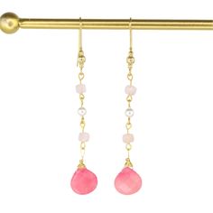 These elegant hand-wired earrings showcase a classic drop design adorned with two pink Jade gemstones, four pale pink Morganite stones, and two luxurious South Sea Pearls. With a 3.25" drop and crafted from gold-plated metal, they add a refined touch to any look. Pink Jade is believed to promote love, reduce stress, and bring luck, while pink Morganite is believed to foster joy and emotional calm. South Sea Pearls are thought to enhance clarity, aid self-expression, and boost self-esteem, making these earrings both beautiful and meaningful. Pearl Charm Necklace, Pink Morganite, Sea Pearls, South Seas, South Sea Pearls, Pearl Gemstone, Pearl Charms, Drops Design, Pearl Drop