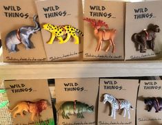 there are many different animal magnets on the shelf