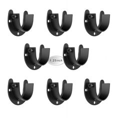 six pairs of black metal brackets on white background