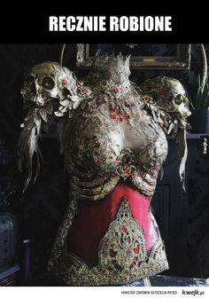 the back of a woman's body with skulls on it and other items around her