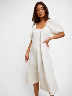 Simple, romantic and chic, with a little vintage flair in breezy double gauze. The perfect midi length with balloon sleeves, tiers and an elegant scoop neck. Vacation ready at a moment's notice. (This one comes in White.) | Women's Mindy Midi Dress in White | Ethical Essentials Bohemian Midi Dress With Gathered Sleeves For Brunch, Billowy Square Neck Midi Dress For Daywear, Flowy Puff Sleeve Midi Dress For Beach, Bohemian Midi Dress With Puff Sleeves For Daywear, Billowy Peasant Dress For Brunch, Cream Puff Sleeve Midi Dress For Brunch, Flowy Puff Sleeve Dress With Balloon Sleeves For Daywear, Flowy Balloon Sleeve Puff Dress For Daywear, Bohemian Flowy Midi Dress With Puff Sleeves