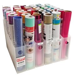 several different colored rolls of paper are in the holder