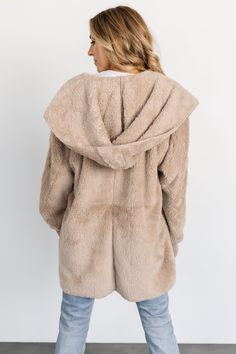 Coziness is calling your name! One size fits most All taupe color Ultra-soft material Open-front jacket style Side pockets Attached hood Perfect for keeping warm Self: 100% Polyester Contrast: 97% Acrylic, 3% Spandex Trina is 5'6, cup size 32D, size 2 and is wearing size S Cozy Beige Outerwear With Soft Texture, Soft-texture Hooded Winter Outerwear, Cozy Beige Hooded Jacket For Cold Weather, Hooded Soft Texture Winter Outerwear, Hooded Beige Outerwear With Faux Fur Lining, Soft Textured Hooded Outerwear For Winter, Cozy Hooded Outerwear With Soft Texture, Hooded Fall Outerwear With Soft Texture, Hooded Outerwear For Cold Weather With Soft Texture