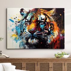 a painting of a tiger on a wall above a bed