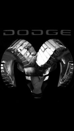 the logo for dodge is shown in this black and white photo, with an image of a ram's head