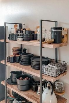 the shelves have pots and pans on them