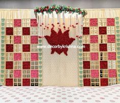 the curtain is decorated with red and white flowers