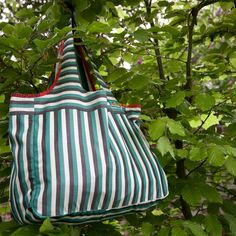 Large striped summer tote Handmade and Striped Summer Bag Canvas shopping bag Reusable shopping bag Fine resistant cotton canvas, evoking classic men's shirts Stripes 1 cm wide green , gray and white . On the front of the bag is sewn a small vintage crest " Hawaii " 4.5 x 2.3 cm Careful tailoring. All interior seams are covered with a coordinated bias tape, made in the main fabric. The outer seams are covered with a red cotton bias ribbon (homemade) with small blue, yellow or green patterns. Uni